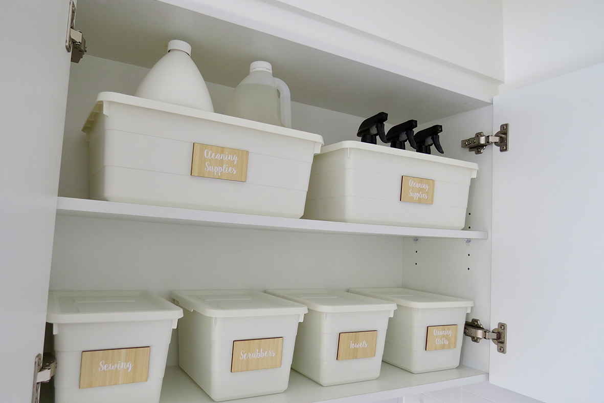 Wardrobe shelves organised with woven baskets and handbags